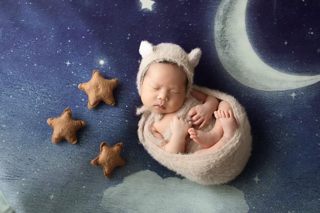 night sky nursery inspiration with star decals moon wall art and soft blush and beige tones